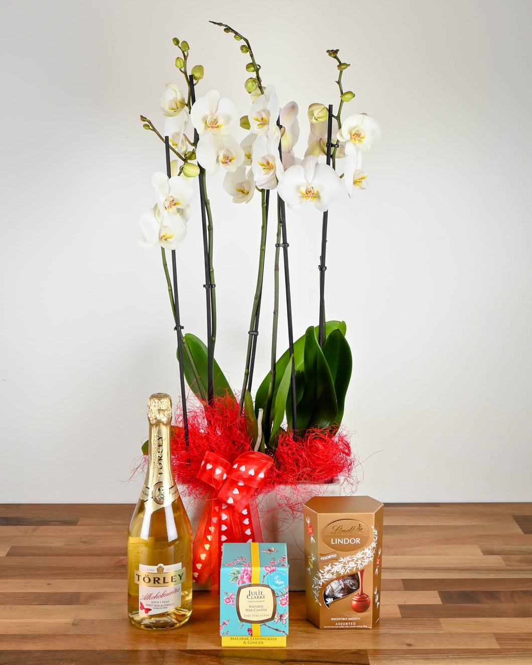 Orchid Gift Deluxe - Orchid Plants, a Julie Clarke Candle, Lindt Chocolate & Non-Alcoholic Fizz